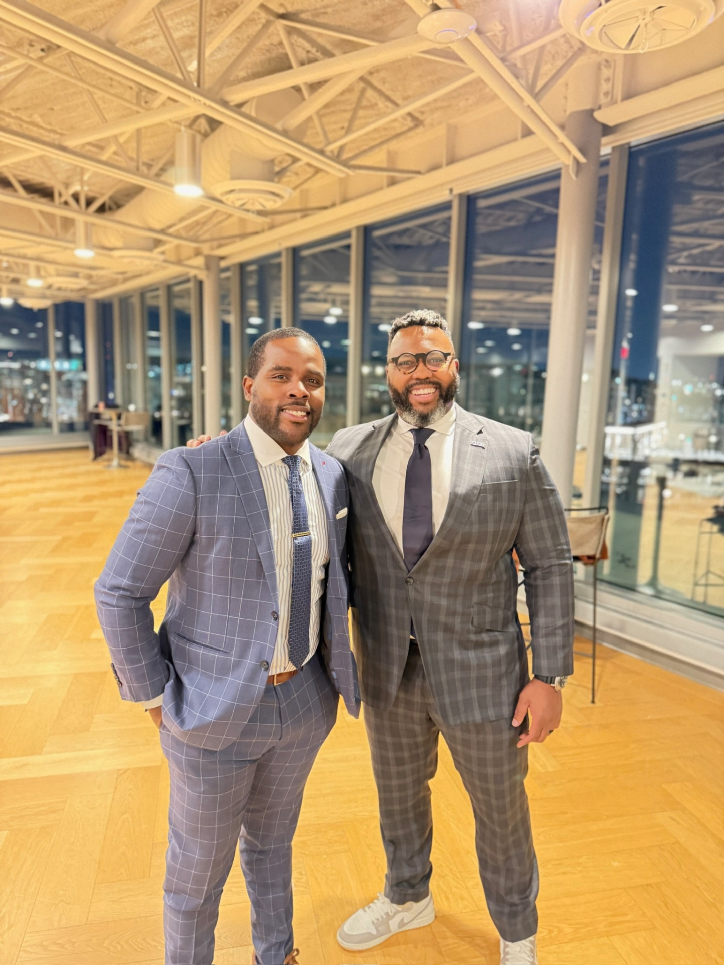 Isiah Williams with a fellow executive at an evening reception