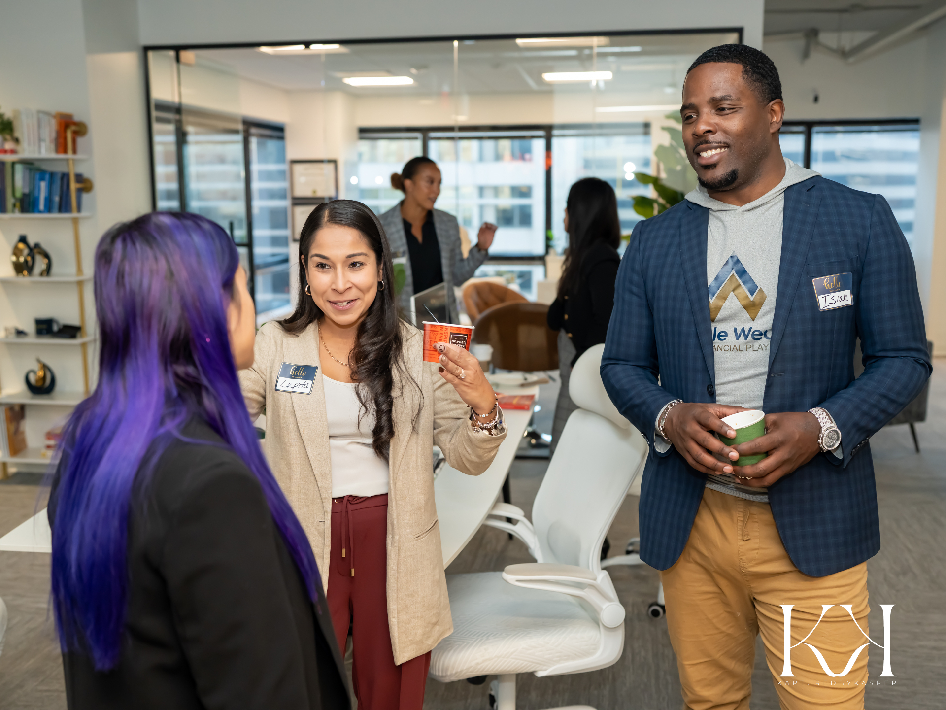 Isiah Williams greeting guests alongside a colleague at an Audible Wealth open house