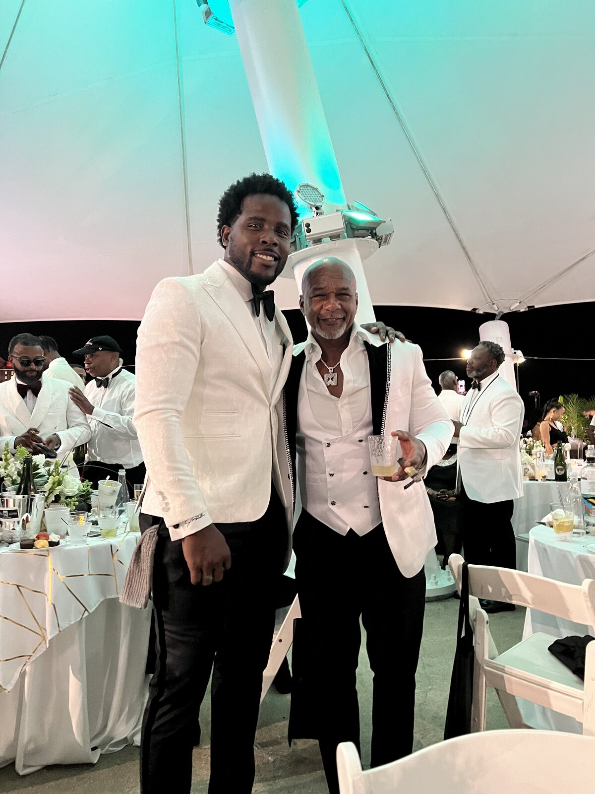 Isiah Williams in a white dinner jacket at a black-tie gala